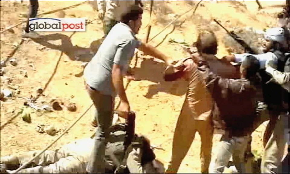 卡扎菲遺體被放肉鋪冷藏室 利比亞或8個月內(nèi)舉行大選