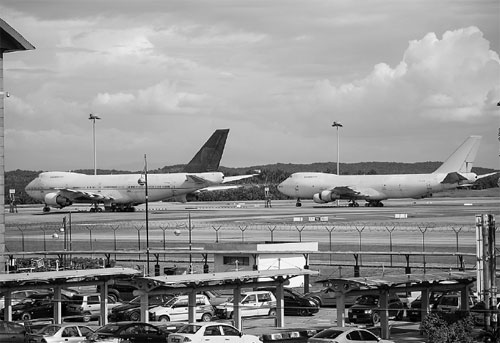 3 abandoned jets clutter large airport
