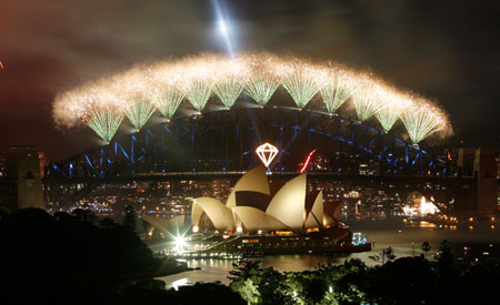 Fireworks explode over the Sydney Opera House and Harbour Bridge during New Year's celebrations January 1, 2007. The celebrations, costing around A$4 million and including 3,000 kilograms of explosives and pyrotechnics, are called