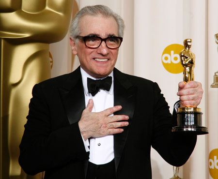 Martin Scorsese poses with the Oscar for Best Director for