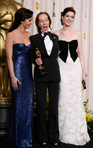 Best Costume Design winner Milena Canonero (C) of