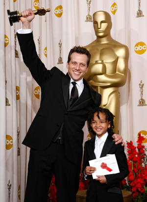 Ari Sandel (L) poses with presenter Jaden Christopher Syre Smith after winning the Oscar for Best Live Action Short Film for