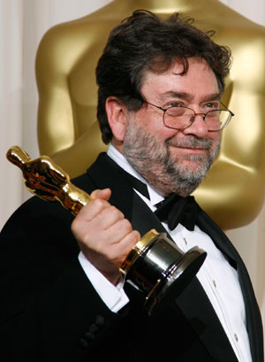 Guillermo Navarro poses with his Oscar for Achievement in Cinematography for
