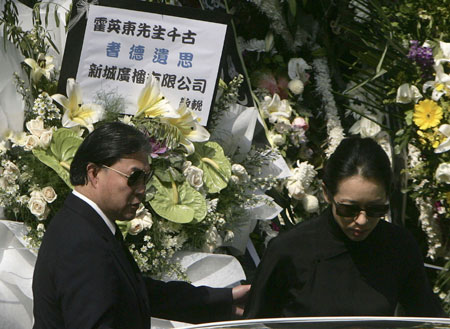 Timothy Fok (L), son of Hong Kong tycoon Henry Fok, and his ex-wife Loletta Chu leave after late billionaire tycoon Henry Fok Ying-tung's funeral outside a funeral home in Hong Kong November 7, 2006.