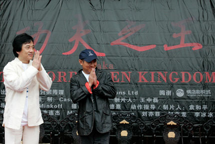Movie stars Jackie Chan (L) and Jet Li gesture during a news conference for the movie