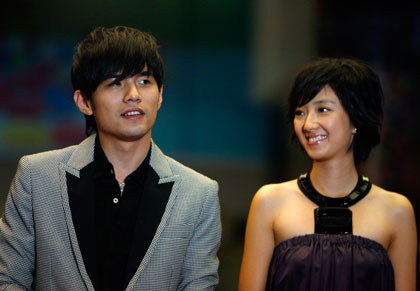 Singer and actor Jay Chou (L) of Taiwan and actress Kwai Lun-mei of Hong Kong arrive for the premiere of his new film