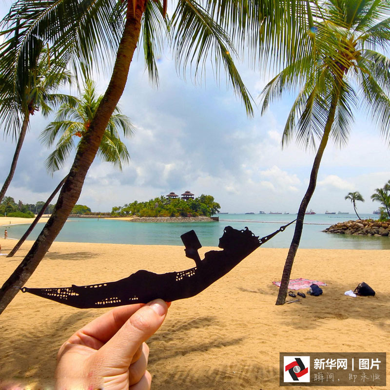 藝術(shù)家剪紙錯位攝影 度假勝地變創(chuàng)意作品趣味十足(組圖)