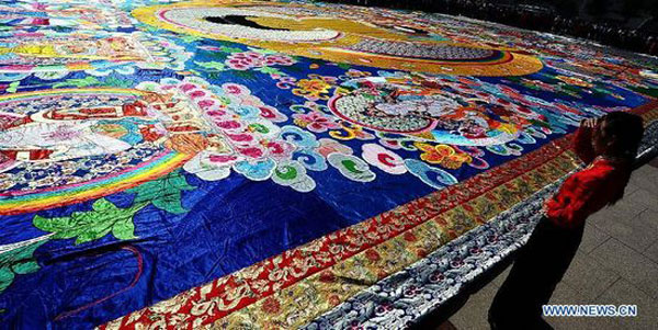 Giant tangka on display in Qinghai Tibetan Culture Museum