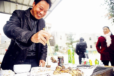 Village's grilled fish amuses Taiwan compatriots
