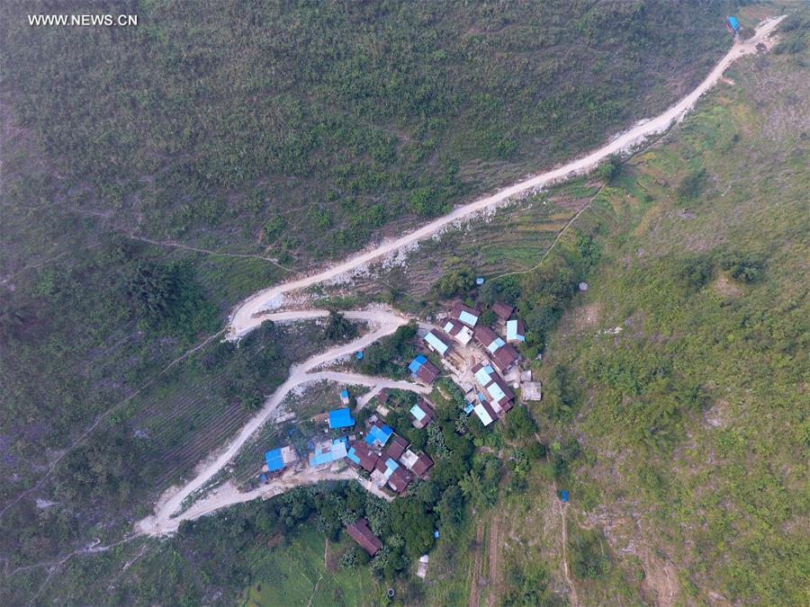 Counstruction of country roads help people to alleviate poverty in Guangxi