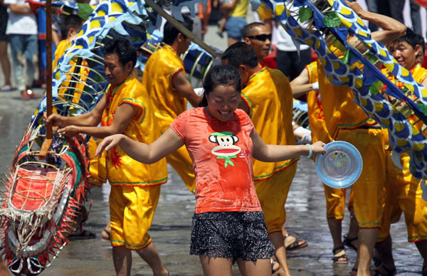 People participate in the annual water festival in Kaili, Southwest China's Guizhou province, on Wednesday. Water Festival in SW China