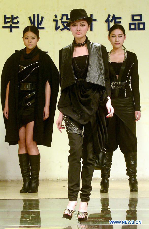 Models present creations of graduates of School of Fashion in Wuhan