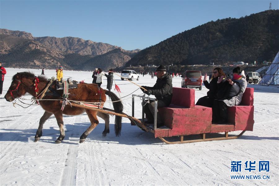 Winter fishing on frozen Zimeng Lake in Chifeng