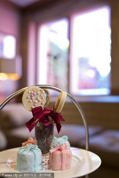 Delicacies are served at the 'baby shower' afternoon tea St James Hotel introduced to celebrate the birth of the first child of the Duke and Duchess of Cambridge in London, England, on July 9, 2013. Royal baby-inspired afternoon tea in London