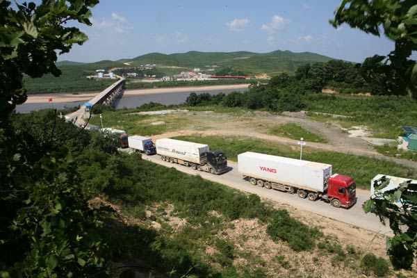 Trucks cross the Tumen River to China's Jilin province, as Sino-DPRK trade expands. Provided to China Daily Stronger links show countries mean business