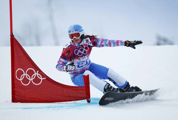 Russia's Alena Zavarzina competes during the women's snowboard parallel giant slalom finals at the 2014 Sochi Winter Olympic Games in Rosa Khutor, Feb 19, 2014. Russia's snowboard couple medals together in Sochi
