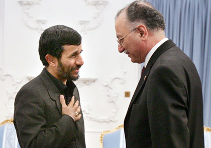 Iranian President Mahmoud Ahmadinejad (L) greets Chief of the Organisation of the Islamic Conference (OIC) Ekmeleddin Ihsanoglu in Tehran June 2, 2006.