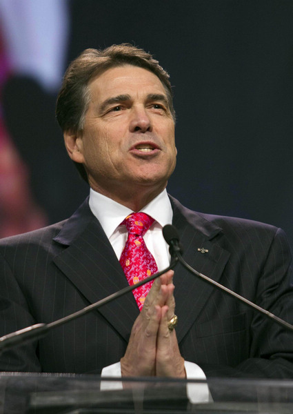 Texas Governor Rick Perry speaks during 'The Response', an event billed as a call to prayer for the nation in crisis, at Reliant Stadium in Houston August 6, 2011. Texas Governor Perry to run for US president