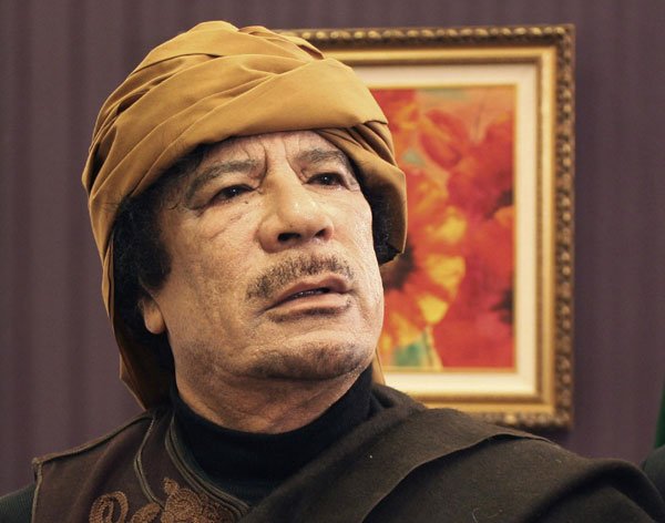 Libya's leader Muammar Gadhafi poses after an interview with TRT Turkish television reporter Mehmet Akif Ersoy at the Rixos hotel in Tripoli in this March 8, 2011 file photo. Gadhafi killed as Libya's revolt claims hometown