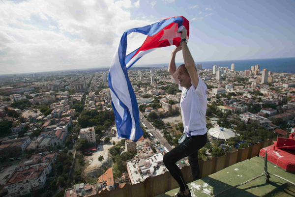 Alain Robert of France, who is known as 'Spiderman', climbs the Habana Libre hotel in Havana Feb 4, 2013. 'French Spiderman' climbs landmark Havana hotel