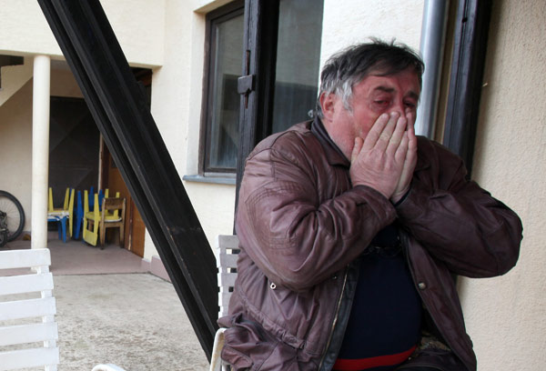 Radmilo Bogdanovic, brother of Ljubisa Bogdanovic, cries in village of Velika Ivanca, Serbia, on Tuesday. Bogdanovic gunned down 13 people, including a baby, in a house-to-house rampage. wsday before trying to kill himself and his wife, police and hospital officials said. Darko Vojinovic / AP Serbia mourns 13 slain in shooting spree