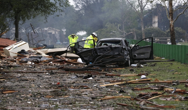 On Thursday morning, firefighters search the debris in a neighborhood destroyed by a massive explosion at West Fertilizer Co in West, Texas. The explosion killed up to 15 people and injured more than 160, officials said overnight, however, the death toll is expected to rise. LM Otero / Associated Press Massive blast rips through Texas town