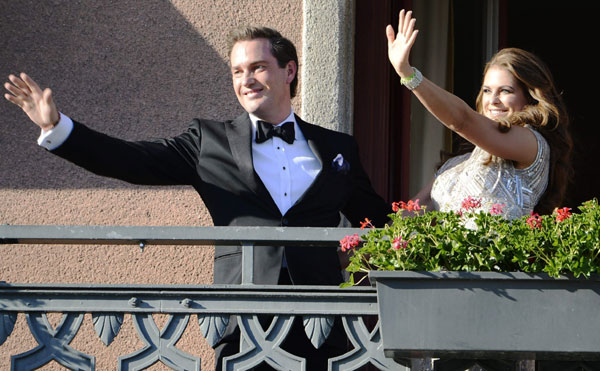 US citizen Christopher O'Neill (left) and Swedish Princess Madeleine wave from the balcony of Grand Hotel prior to a dinner for the couple in Stockholm June 7, 2013, the day before their wedding. Sweden's Princess Madeleine weds New York banker