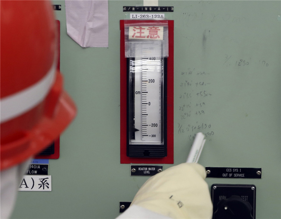 Water levels at a reactor just after the March, 2011 earthquake and tsunami remain scribbled on a control panel in the central control room of the No 1 and No 2 reactors at the Fukushima Daiichi nuclear power plant at Fukushima prefecture March 10, 2014 Visit to Fukushima nuclear plant on meltdown anniversary